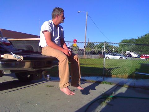 2006 Ford E350 - Johnny, siting on Chelsea's tailgate, drunk.