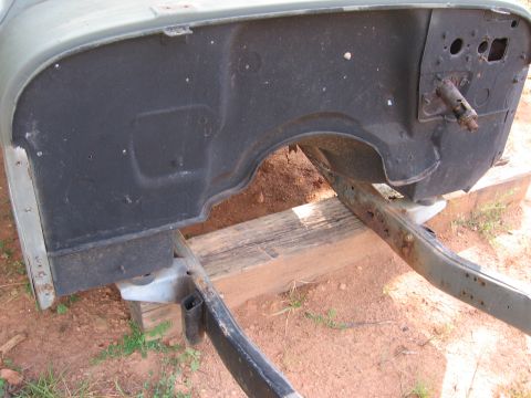 1980 Jeep CJ7 - This image shows a section of a Jeep CJ tub and frame, focusing on the inner fender well and the condition of the frame rails.