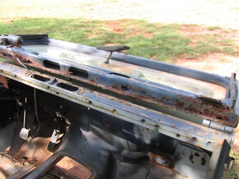 1980 Jeep CJ7 - This is a rusted Jeep CJ tub and windshield frame, showing interior pedals.