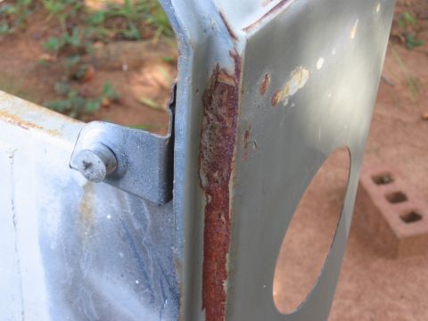 1980 Jeep CJ7 - Detail of a rusted metal frame, showing corrosion and a mounting bracket.