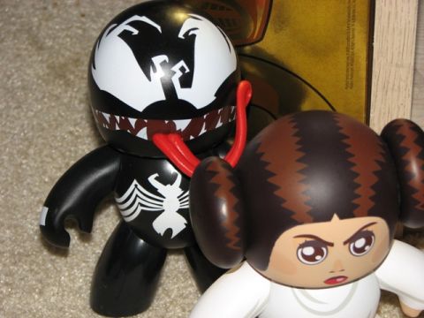 1991 Ford Bronco - Two collectible figures, one resembling Venom and the other Princess Leia, are displayed together.