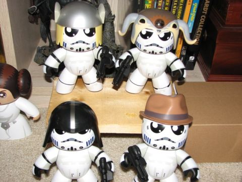 1991 Ford Bronco - A collection of Star Wars figures, including stormtroopers and Princess Leia, are arranged on a shelf.