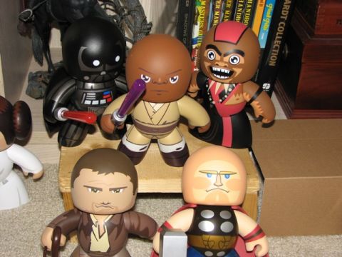 1991 Ford Bronco - Several collectible figures, including Darth Vader and Obi-Wan Kenobi, are displayed on a shelf.
