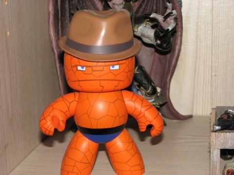 1991 Ford Bronco - A toy figure resembling The Thing from Fantastic Four is shown wearing a brown fedora and blue briefs.