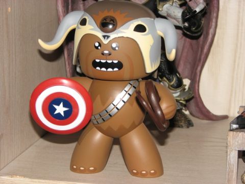 1991 Ford Bronco - A toy figure resembling Chewbacca, dressed as Captain America, is displayed on a shelf.