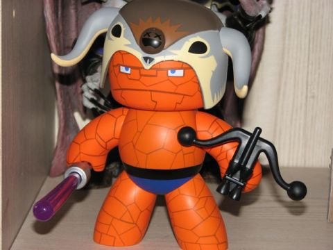 1991 Ford Bronco - Toy figure with a crossbow and staff, wearing a horned helmet and blue shorts.