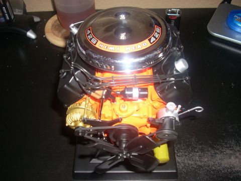 1992 Ford Bronco - A detailed model of a 426 Hemi Head engine is displayed on a black surface.