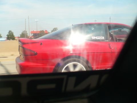 1993 Ford Probe - Side view of a red 1993 Ford Probe coupe with a spoiler.