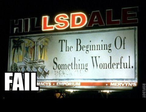 1988 Mercury Grand Marquis - A nighttime view of a large billboard advertising Hillsdale, text and store names.