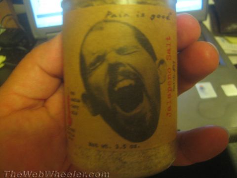 1968 Ford Mustang - A jar of jalapeno salt is held in a hand, with a label a screaming face and text.