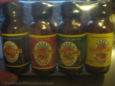 1968 Ford Mustang - A four-pack of Dave's Gourmet Hot Sauce bottles, Insanity, Cool Cayenne Pepper, Hurtin' Jalapeno, and Roasted Garlic flavors.