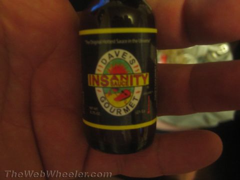 1968 Ford Mustang - A bottle of Dave's Insanity Gourmet Sauce is shown, labeled as 'The Original Hottest Sauce in the Universe'.