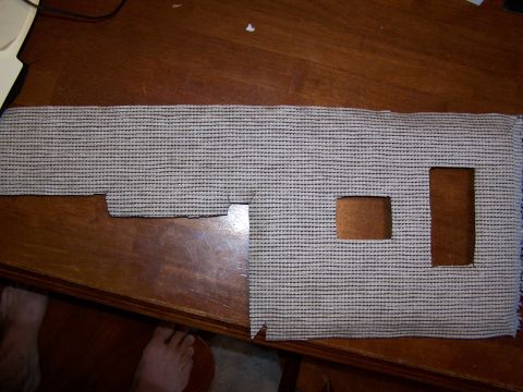 1986 Ford Bronco - Carpet piece with cutouts, possibly for door panel installation.