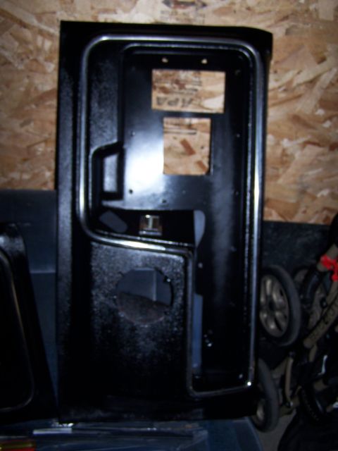 1986 Ford Bronco - Close-up of a black door panel, showing its internal structure and mounting points.
