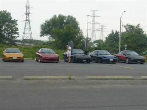 1993 Ford Probe - A lineup of five Ford Probes, with one showing off its upward-opening doors.