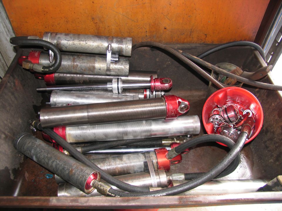 Shock absorbers and parts in a rusty container