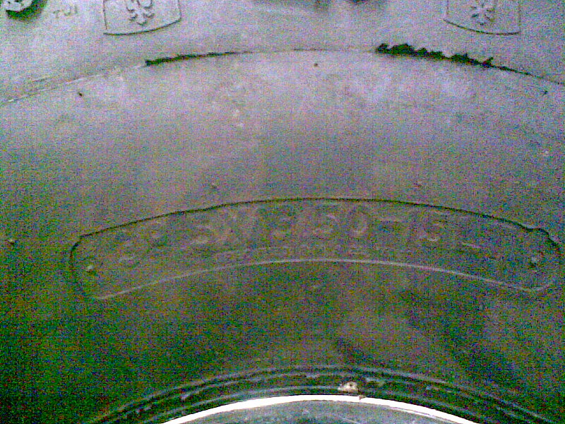 Close-up of a tire with text 33X12.50-15