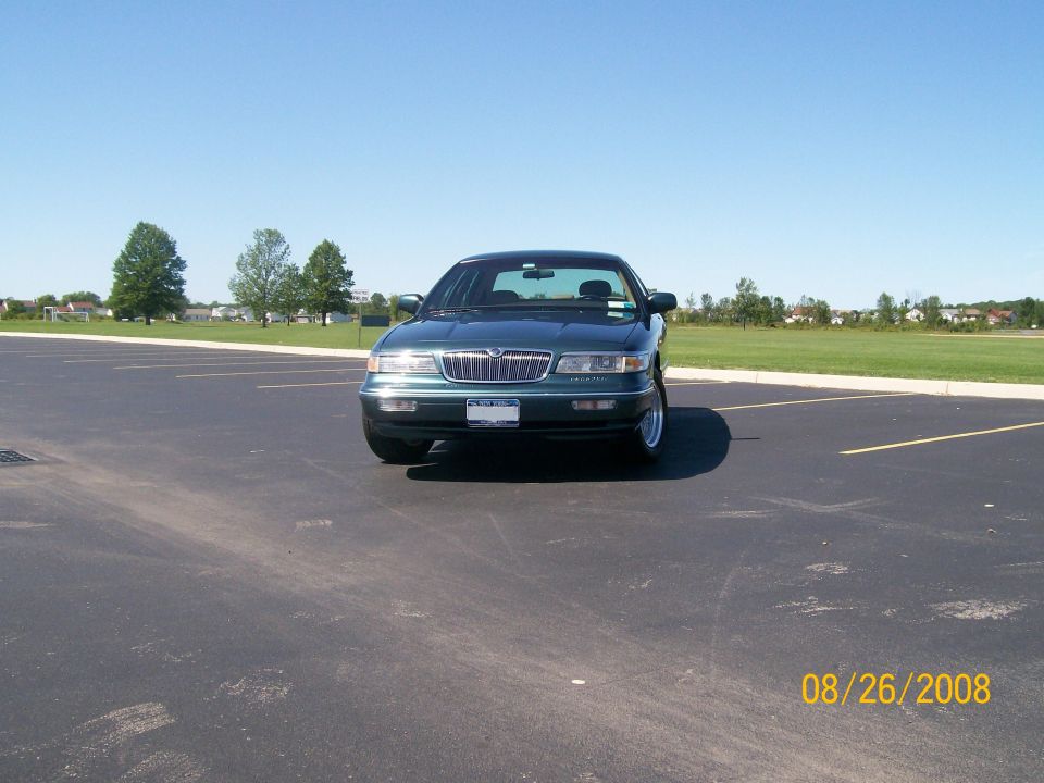 1995 Mercury Grand Marquis parked in an asphalt lot.