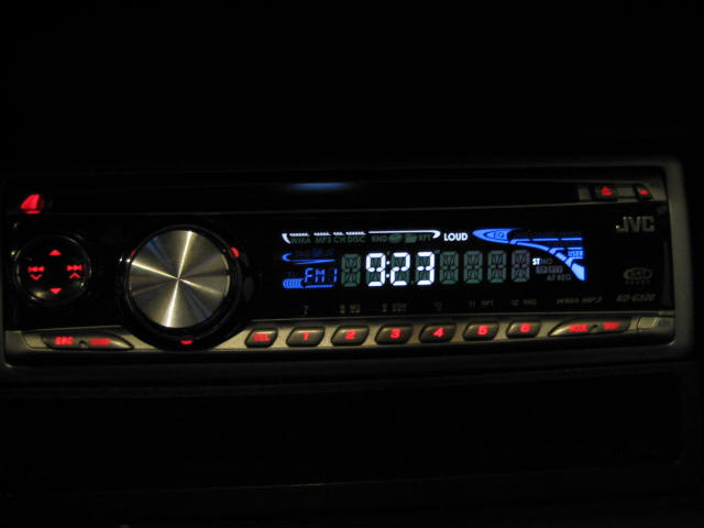 JVC car stereo with digital display showing 9:23