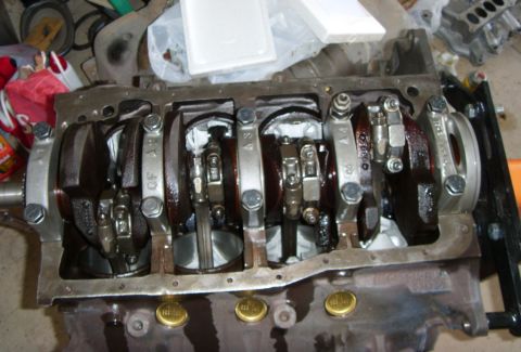1989 Ford F-250 - A close-up view of the internal components of a V8 engine, likely a Ford FE or similar big-block, showing the crankshaft, connecting rods,…