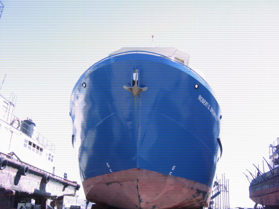 Bow of a large blue and red ship with name "ROBERT G. BROWNLER" visible.