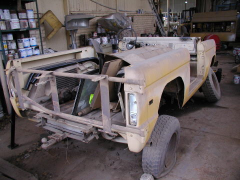 1971 Ford Bronco - This disassembled Ford Bronco is undergoing restoration work in a garage setting.