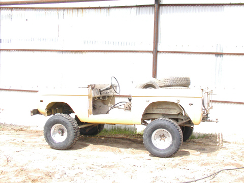 1971 Ford Bronco - A vintage Ford Bronco, stripped down and ready for restoration, is viewed from the front-three-quarter angle.