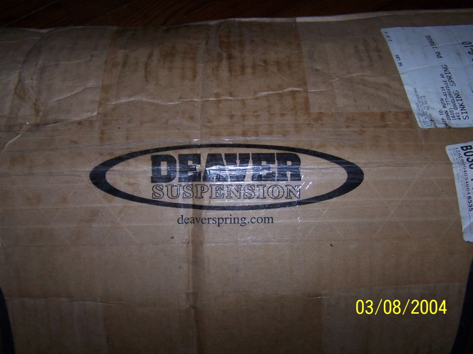 Cardboard shipping box printed with Deaver Suspension logo