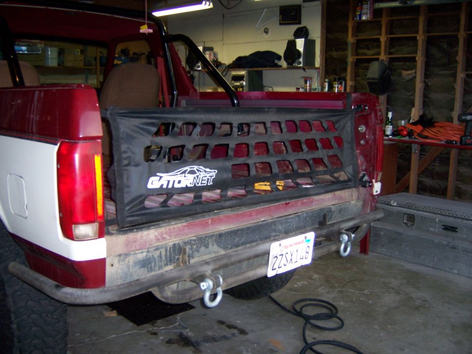 Rear photo of a truck with Gatornet tailgate net in a workshop