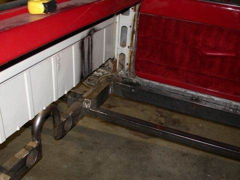 1964 Ford Ranchero - Close-up view of the interior door panel and exposed frame of a 1964 Ford Ranchero, showing custom metalwork.