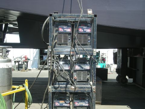 1991 Ford Bronco - A rack of welding machines is shown in an outdoor industrial setting.