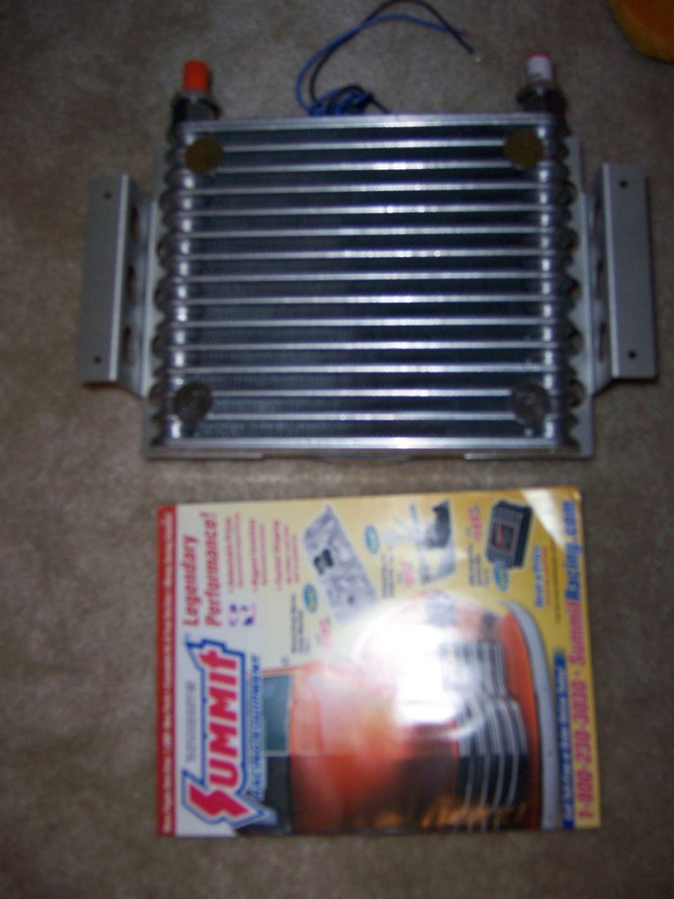 Transmission cooler next to Summit Racing catalog