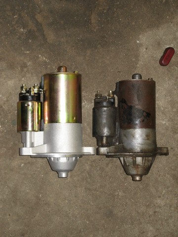 1995 Ford Bronco - A new starter motor is shown next to a used and corroded one, likely for comparison.