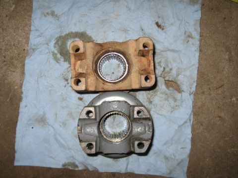 1995 Ford Bronco - Comparison of a used drive shaft yoke with a new replacement part.