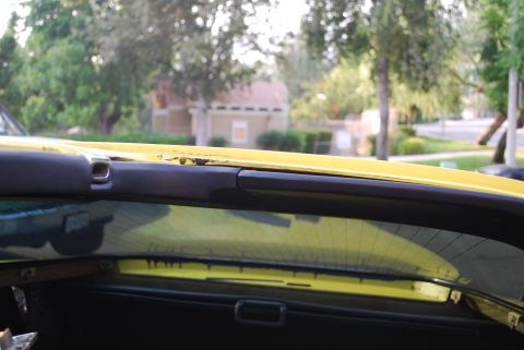 1979 Chevrolet Corvette - Interior view of a yellow car, showing the roofline and rear window, with a website address visible.