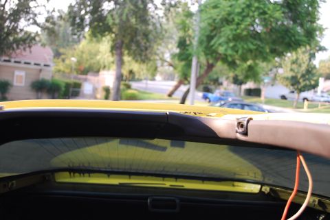1979 Chevrolet Corvette - Interior view of a yellow vehicle, showing the t-top area and some exposed wiring.