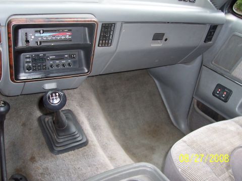 1988 Ford Bronco - Interior view of a 1988 Ford Bronco, highlighting the dashboard and manual gear shifter.