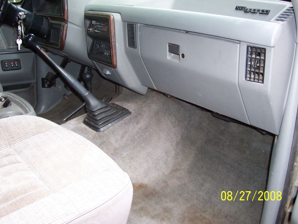 dashboard, steering wheel, and gear shifter of a truck
