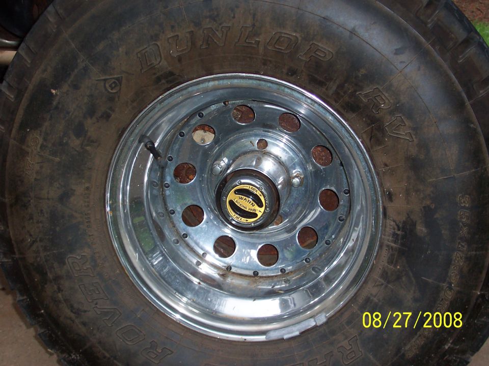 Chrome wheel with a WARN locking hub and a Dunlop Rover tire. Date stamp reads 08/27/2008