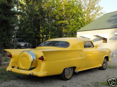 1953 Ford Mainline - Customized 1953 Ford Mainline sedan with a continental kit and prominent tail fins.