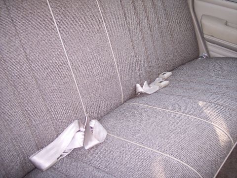 1972 Ford Ranchero - The patterned fabric and seatbelt design are consistent with a 1972 Ford Ranchero interior.