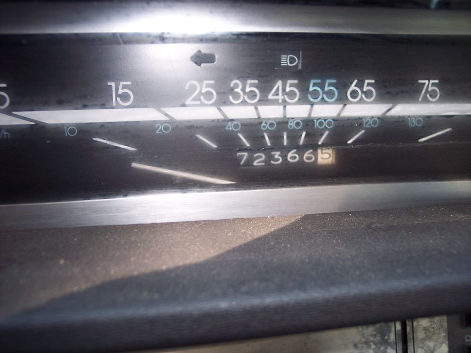 Horizontal speedometer close-up with 55 mph in blue and odometer showing 72,366 miles