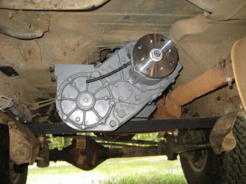 1995 Ford Bronco - The vehicle's transfer case and exhaust system are visible from underneath.