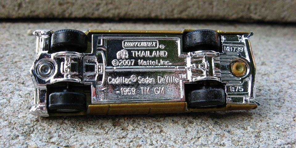 Chrome baseplate of Matchbox 1969 Cadillac Sedan DeVille die-cast showing Mattel markings