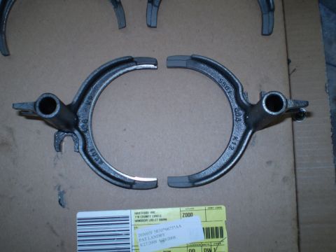 1995 Ford F-150 - Two transmission shift forks are shown, with visible part numbers and a shipping label.