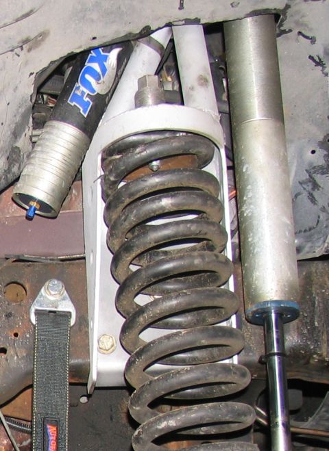 1984 Ford Bronco - Custom front suspension components, including a Fox shock and heavy-duty coil spring.