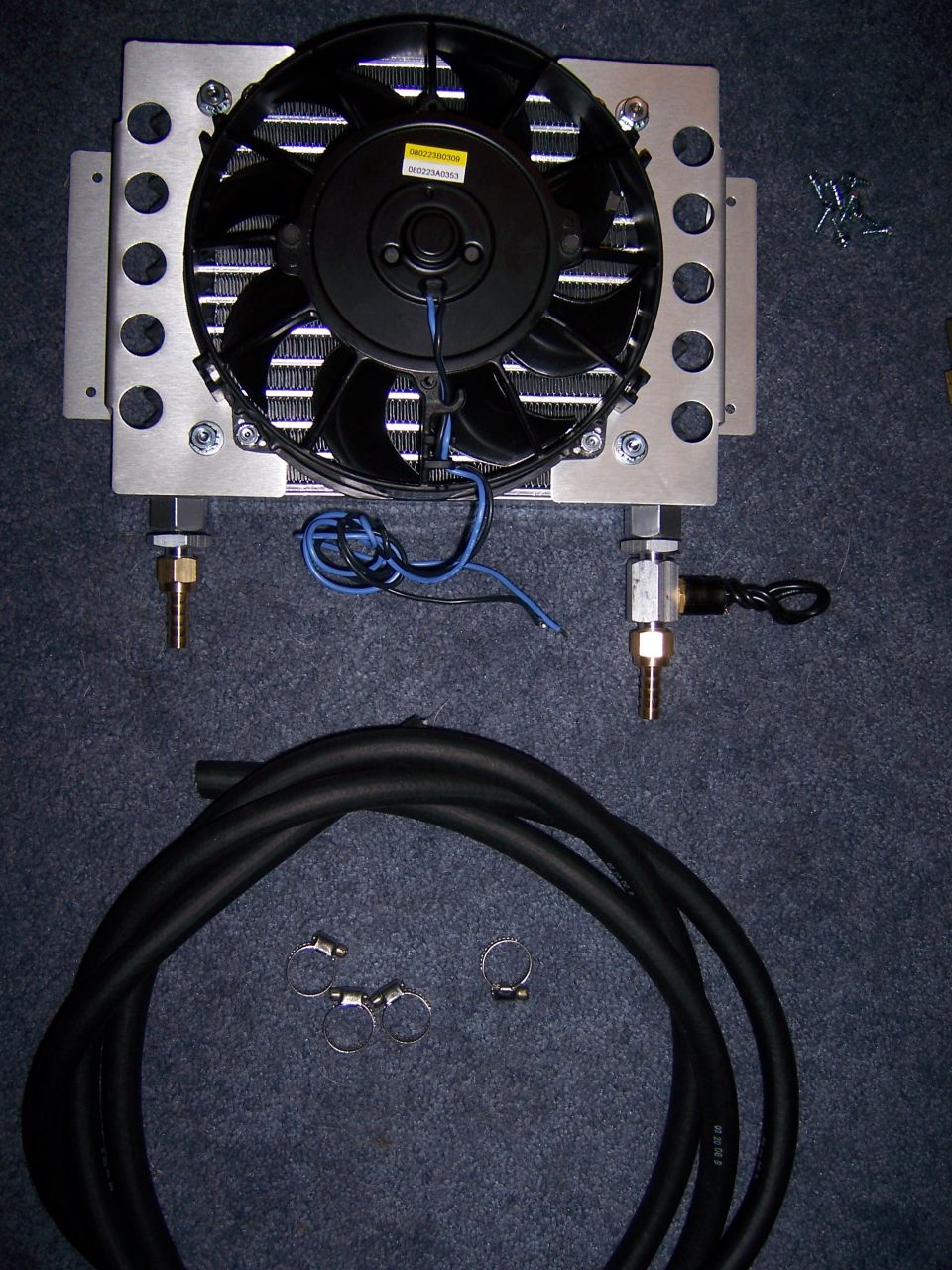 Transmission cooler with fan and hoses