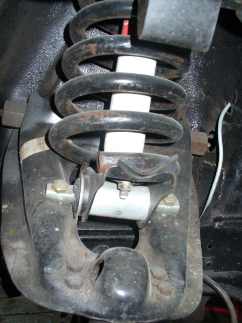 1968 Ford Mustang - Front suspension component, likely from a classic car, showing a coil spring and shock absorber.