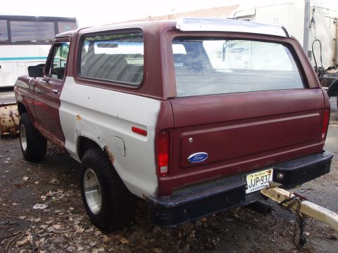 1979 Ford Bronco - This Ford Bronco has a two-tone paint job with one side in primer, showing some rust.