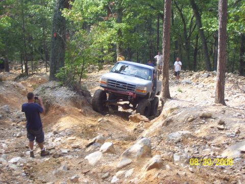 1978 Ford Bronco - Off-road truck navigates a challenging rocky incline on a wooded trail. The date 08/30/2008 is visible.